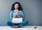 Brazil, mockup or portrait of black woman on floor on laptop for planning creative idea, strategy or website review