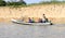 Brazil, Obidos: Amazon River - Brazilian Family in Boat with GPS Dish