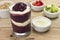 Brazilian acai with baby milk and fruits in wood background