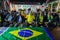 The Brazilian ambassador to Palestine, Francisco Mauro Uland Brasil, watches the Brazil national team match against Switzerland