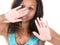 Brazilian american african woman over isolated white background making stop gesture with her hand