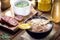 Brazilian bean broth, homemade bean soup served warm in winter, with ingredients in the background