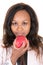 Brazilian black woman african american young woman with red apple in hand