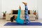 Brazilian black young woman training yoga at home