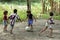 Brazilian boys and girls playing football in tropical heat