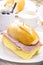 Brazilian breakfast, french salt bread with mozzarella cheese and ham, served with hot coffee