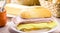 Brazilian breakfast, french salt bread with mozzarella cheese and ham, served with hot coffee and cornmeal cake