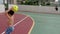 Brazilian child of 7 years playing handball with his mother. Scoring a goal