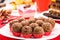 Brazilian chocolate bonbon, called Brigadeiro, made with condensed milk, chocolate powder and sprinkles, served with cake at