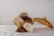 Brazilian cocada coconut candy placed in a glass jar on a table with white towel, selective focus