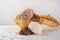 Brazilian cocada coconut candy placed in a glass jar on a table with white towel, selective focus