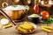 Brazilian cuisine, called polenta, traditional brazilian fries, with cornmeal and sauce in the background, rustic setting