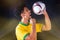 Brazilian Football Black Player Holding Ball and Celebrating