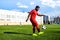 brazilian football player on stadium kicking ball for winning goal outdoors