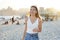 Brazilian girl walking on Ipanema beach at sunset, Rio de Janeiro, Brazil