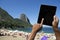 Brazilian Hands Using Tablet at Sugarloaf Rio de Janeiro Brazil