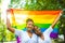 brazilian lesbian couple in white dress spending time together celebrating engagement in summer park outdoor