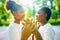 brazilian lesbian couple in white dress spending time together celebrating engagement in summer park outdoor