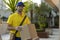 Brazilian mailman delivering a package