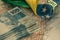 Brazilian money, 100 reais banknotes on the map of Brazil with a fragment of the national flag