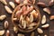 Brazilian nuts peeled in wooden bowl, top view