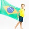 Brazilian patriot boy holding Brazil flag. Football or soccer championship