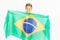 Brazilian patriot boy holding Brazil flag. Football or soccer championship