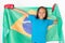 Brazilian patriot, fan girl holding Brazil flag. Brazilian boxing championship.
