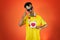 Brazilian Player- Black Man Celebrating With Yellow T Shirt Isolated on Orange background