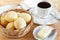 Brazilian snack cheese bread (pao de queijo) with cup of coffee
