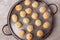 Brazilian snack cheese bread (pao de queijo) on oven-tray