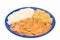 Brazilian tenderloin stroganoff with rice and potato sticks in a blue plate isolated in white background