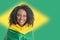 Brazilian woman fan celebrating on football match on white background. Brazil colors.