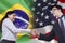 Brazilian woman shaking hands with American person