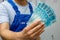 Brazilian worker showing money. Bundle of banknotes of one hundred reais, Salaries of professionals and blue collar workers