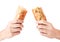 Bread baguette is broken in half in hands on a white background. Isolated