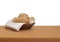 Bread basket. Wholemeal brown bread rolls with white cloth, serviette aka napkin. Isolated against white behind.