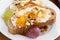 Bread with butter, honey, nuts and grapes