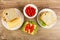 Bread and cheese, bowl with pepper, sandwiches with cheese, lettuce, sweet pepper on table. Top view