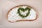 Bread With Cheese Cream Spread And Heart Made Of Herbs