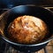 Bread cooking in a dutch oven