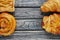 Bread danish and croissant on top view wooden background with empty space, healthy eating