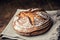 Bread.Fresh round crisp bread with caraway on wooden table