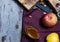 Bread fruits and jam on the scratched wooden cutting board