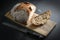 Bread. Homemade sliced whole grain bread on a cutting board with a knife