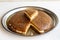 Bread kadayif on a white background. Sliced bread kadayif in a tray