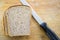 Bread and knife on breadboard