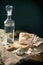 Bread lard garlic and carafe with a glass of vodka on sackcloth vintage, tinting