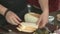 Bread Loaf Male hands Slicing bread on table