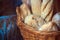 Bread loaves and baguettes in a wicker basket